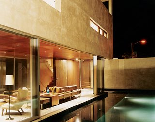 The Jonathan - Photo 9 of 10 - Apart from being visually stunning, the reflecting pool just outside of the living room also acts a sound barrier—the gurgling water cancels out traffic noise.