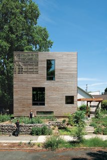 A basic box that’s as tall as it is wide (28 feet) and 16 feet long, this Portland, Oregon house consists of rooms stacked vertically: an unfinished basement on the bottom, a kitchen-living area and a bathroom in the middle, and a bedroom on top, with the stairwell hinged onto the front of the home. The only interior doors are those to the bathroom, basement, and root cellar, leaving the rest of the space open and unfettered. At just 704 square feet, Katherine Bovee and Matt Kirkpatrick's home is a great lesson in making the most out of every inch. Click here to see the interior.