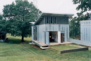 The decidedly nontraditional structure includes a front wall that opens the living room onto the front yard—and to the rest of the neighborhood, which has enthusiastically welcomed the house and its owner.