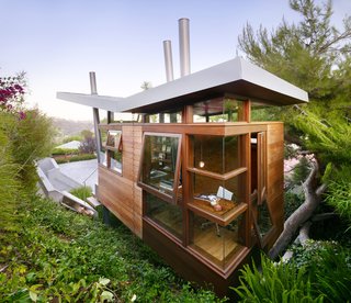 An Atypical Tree House - Photo 11 of 11 - Large floor-to-ceiling windows and doors provide abundant natural light and ventilation.