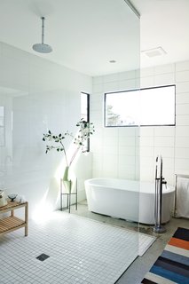 The First LEED Gold-Certified Family Home in San Diego - Photo 8 of 13 - Part of a 1,000-square-foot space the brothers designed for their parents, the master bath features a Whittington Marlon bathtub from Signature Hardware.