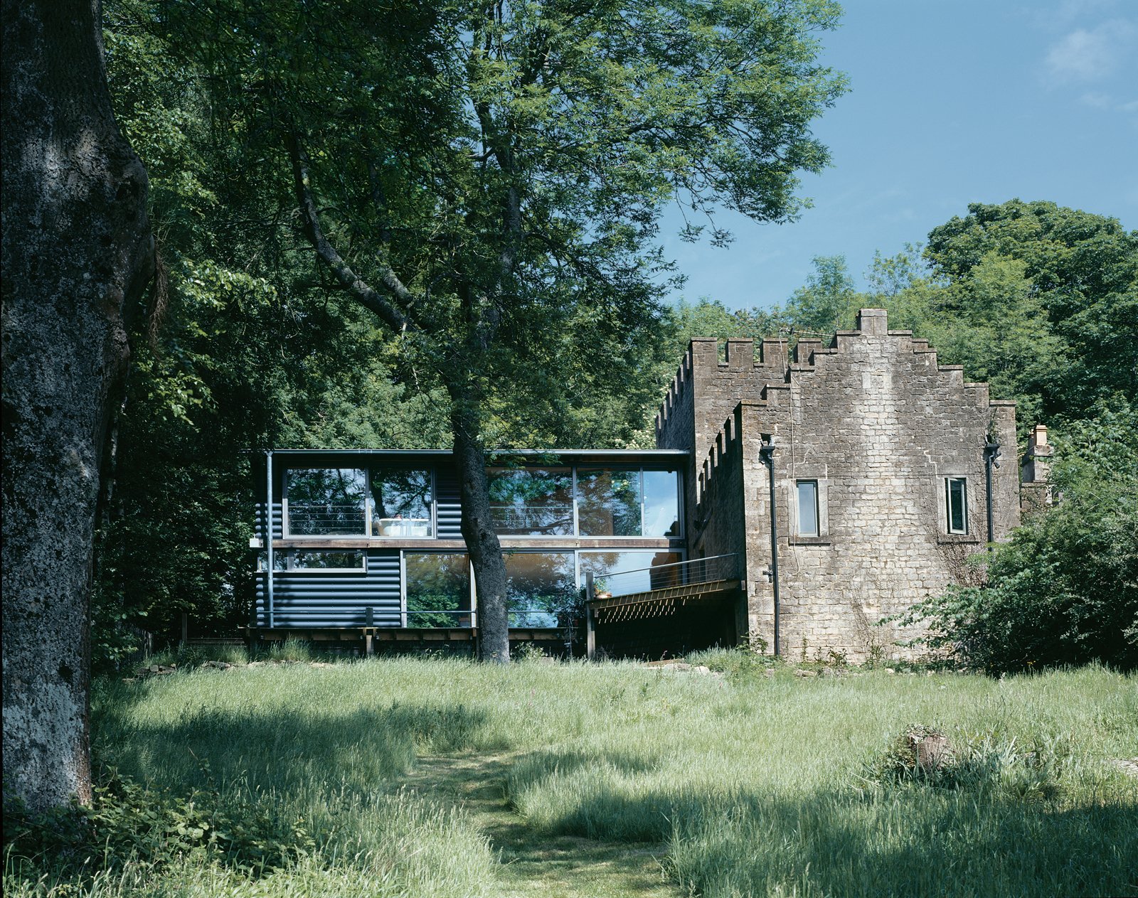 Moonshine is beautifully set in an isolated spot in the English countryside outside of Bath. The dramatic juxtaposition of a stone gamekeeper's cottage and a modern timber framed addition gives the home a quaint, pastoral feel while capitalizing on the dramatic view of St. Catherine's Valley.