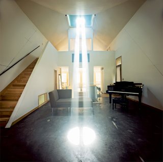 This House Tells the Time With an Oculus - Photo 1 of 6 - Inside the house, the speed of the planet’s rotation is indicated by the rate of the light beam’s movement over the floor and walls. When the Burkes first moved in, the speed of shifting light made them dizzy.