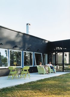 The homeowners were impressed by the way Salmela conflated the indoor/outdoor continuum. "We really needed that contact with the lake and the woods even when inside," says Golob. All outdoor seating by Kartell.