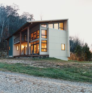 The home is clad in galvanized corrugated metal.
