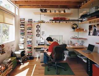 Casa Study House #1 - Photo 9 of 10 - A preoccupation for Levine was saving space and money; he and his team used threaded steel rods and birch veneer plywood to construct the shelving in his office at the rear of the house.