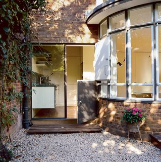 Original elements such as the curved glass windows, added in the 1930s, remain, as does the original parquet floor.