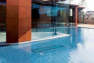 Holl designed rectangular punctures in the various roofs and in the central pool of water to allow bars of light to dance and play on the interior.