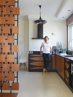 Modern Home Furnished With Flea Market Finds - Photo 1 of 17 - In the renovation of a 1950s building in Royan, France, interior designer Florence Deau selected a fleet of vintage and new furnishings.