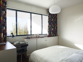 Modern Home Furnished With Flea Market Finds - Photo 8 of 17 - The curtains are made from graphic Gastón y Daniela fabrics.