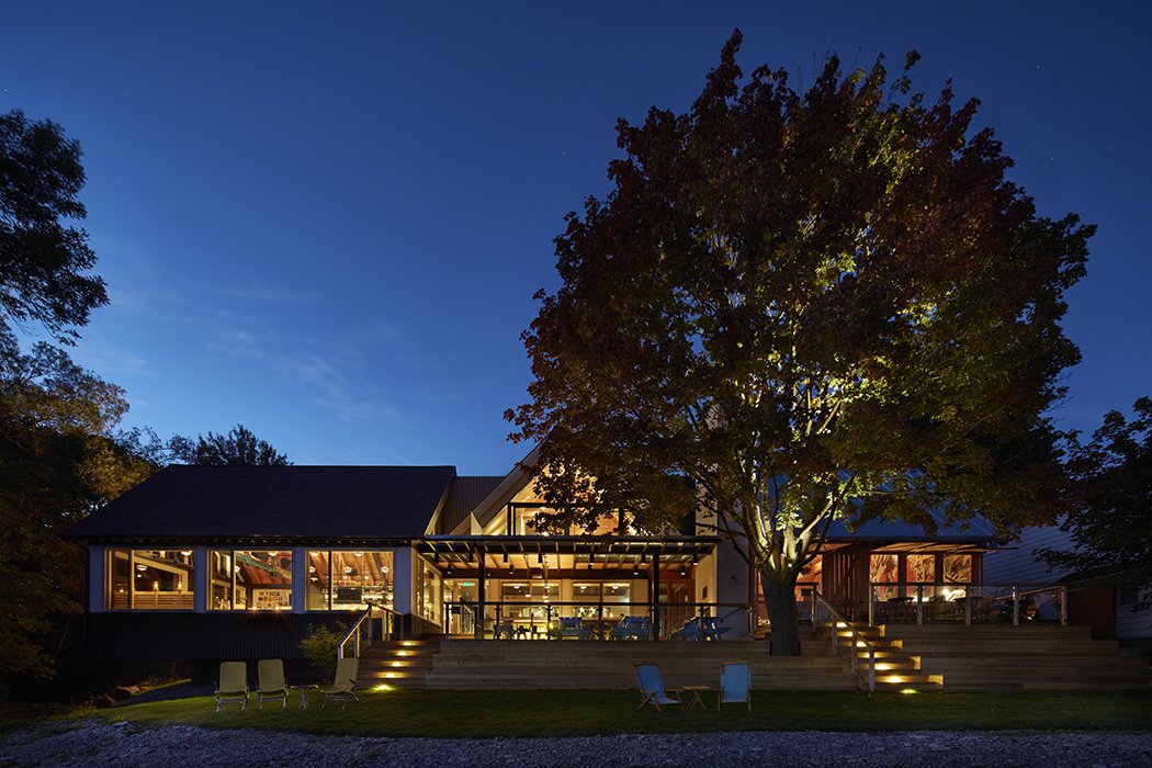 The structure was originally built as a foundry in the late 19th century and became a bed and breakfast before hotelier Jeff Stober purchased the property. “We are offering visitors and locals alike a really fun and inspired experience in one of the most beautiful regions of Canada,” he says. The Owner's Suite is underneath the gable on the second floor. Guests have access to expansive outdoor decks around the building.