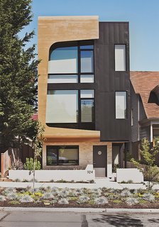 Green and Affordable Structure Fits Three Families in One 28-Foot-Wide Lot - Photo 1 of 11 -