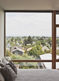 Green and Affordable Structure Fits Three Families in One 28-Foot-Wide Lot - Photo 4 of 11 -