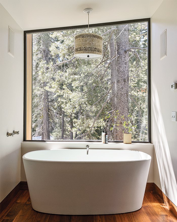 40 Modern Bathtubs That Soak In the View In the master bathroom, a matte Ove tub from Wetstyle is one of Maca’s favorite getaways. The angle of the custom window, designed with a minimal frame to maximize the view, mimics the roofline.
