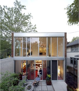 Here's a proper view of the back of the house that reveals the height of the space and how the courtyard really does function as an outdoor room.