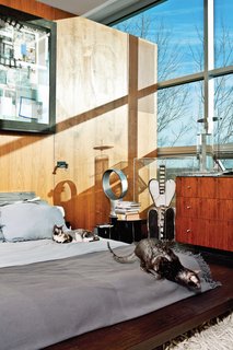 The master bedroom; the painting is by Radcliffe Bailey.