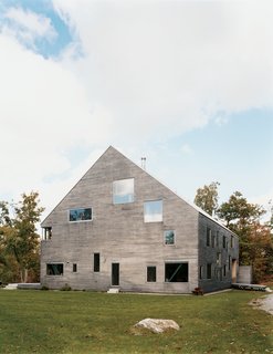 Raising the Barn - Photo 7 of 7 - The Pine Plains, New York, home of Elise and Arnold Goodman boasts 48 windows, the largest of which measures 8'6'' by 7'6''. As architect Preston Scott Cohen explains, the "free facade makes it impossible to identify how many levels there are, or even to tell the difference between a door and a window." From without, the windows reveal dramatic glimpses of the 18th-century barn farm and new steel structure that support the house. From within, says Elise, "Each season, each time of day, offers a different view of the world. It's spectacular."