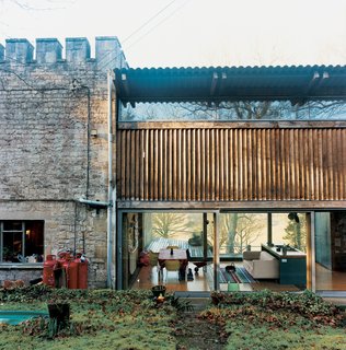The rear facade reveals a glimpse of the living room.