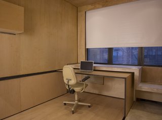 When rolled across the apartment, the table serves as an extension of the concrete desk, partially tucking underneath to extend the work surface and create an interplay of materials. "Each part must serve multiple functions," says Chan.