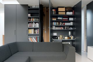 Reeve's partner, Michela Meazza, uses built-in closets for her home office. The imposing gunmetal gray doors can simply be swung shut at the end of a long day's work. The sofa is by Rock Galpin.