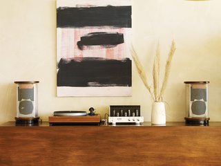 How a Bungalow Went from Bland to Brilliant - Photo 7 of 9 - Pearson and Trent designed the sideboard just tall enough so that their young children, Delphine and Chantal, couldn’t reach the vintage stereo. Above it is a painting by Los Angeles artist Jon Pestoni.