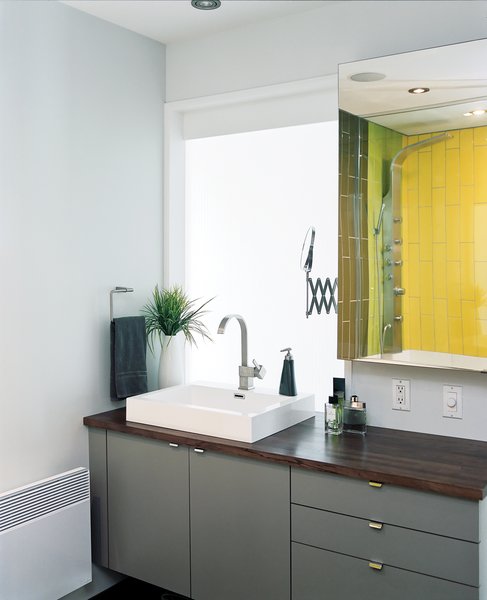 Tiles from Ramacieri-Soligo brighten the bathroom, off the hall.