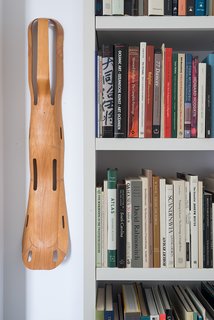 On a wall hangs a leg splint designed by Charles and Ray Eames for the U.S. Navy in 1942.