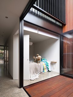Renovated 19th-Century Terrace House Merges with the Outdoors - Photo 5 of 7 - An internal courtyard anchors the house while ushering in air and light. Its materials echo those used in the rear yard. "You get a glimpse of both outdoor spaces when walking through the house," Abicic says.