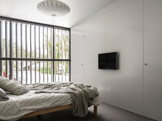Renovated 19th-Century Terrace House Merges with the Outdoors - Photo 7 of 7 - Full height louvers are used throughout the house, opening the interior spaces up to the outdoors.