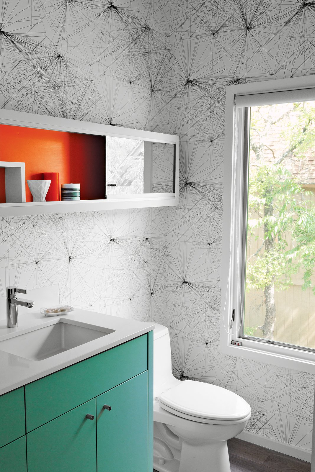 How to Use Modern Home Decor in Unexpected Ways - Photo 7 of 9 - In the new powder room, Jill Malek wallpaper adds graphic punch to custom cabinetry.