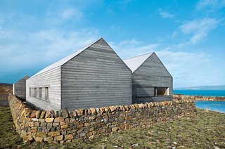 A Pitched-Roof Dwelling on Scotland's Isle of Skye - Photo 2 of 2 - Dominic Houlder’s monastic residence features a Caithness stone floor and oak-veneered walls and ceiling.