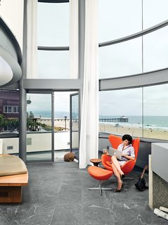 Dukes, who was hands-on with the redesign, sits in an Arne Jacobsen Egg chair in the living area.