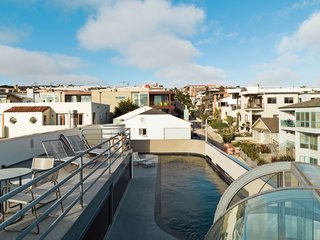 A view over the lap pool and roof deck, which provides a respite for the couple, shows the dense beachside neighborhood. The couple bought the Richard Schultz chaise longues at Studio 111 in Palm Springs.