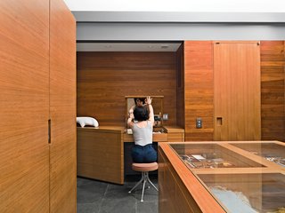 Dukes designed the island in the paneled dressing area.