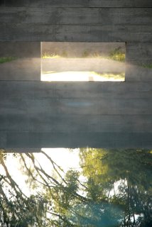 A reflecting pool for a residence that Aidlin Darling designed in San Joaquin Valley, California. "This rural residential project incorporates the agricultural vernacular language of California's Central Valley, including irrigation aqueducts and vastness of scale," David Darling says. "Landscape, materiality, and the cooling effect of water elements were paramount." Photo courtesy of the Sonoma Valley Museum of Art.