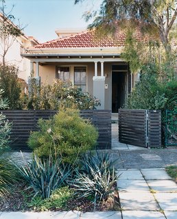 The façade of the original semi-detached bungalow is untouched, suggesting a run-of-the-mill suburban abode.