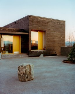 The House for a Musher is all about taking advantage of its hilltop site. The courtyard in the front has vast views and the house itself is oriented toward the surrounding landscape.