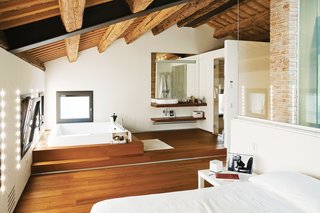 The top floor holds the Chiavellis’ bedroom suite, with a dressing room and built-in spa. "The farmers dried their crops up here," says Chiavelli. "We knew right away this was the spot that we wanted to have our own room."