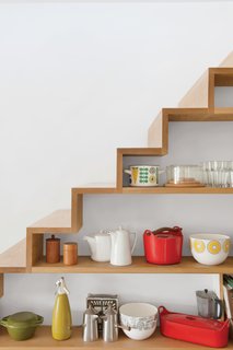 A closer look at the shelving built into the staircase in the kitchen.