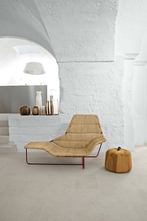Serafini and Palomba’s vacation home is a cavernous showcase for their own designs. In the living room, they created a one-off version of their Lama chaise longue, originally designed for Zanotta. The Zen Apple side table, also theirs, is from the Sen Line Collection by Exteta. The vases are by Guaxs.