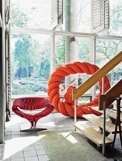 The ground floor of the house opens up to a three-story atrium and hosts a few pieces from Larsen’s wide-ranging collections, like a rope sculpture by Mariyo Yagi.
