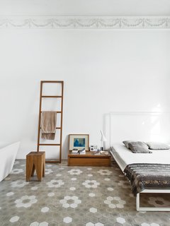 The master bedroom includes a Mini bed by Emaf Progetti for Zanotta, a tub by Sanico, and a towel rack and side table by Philipp Mainzer.