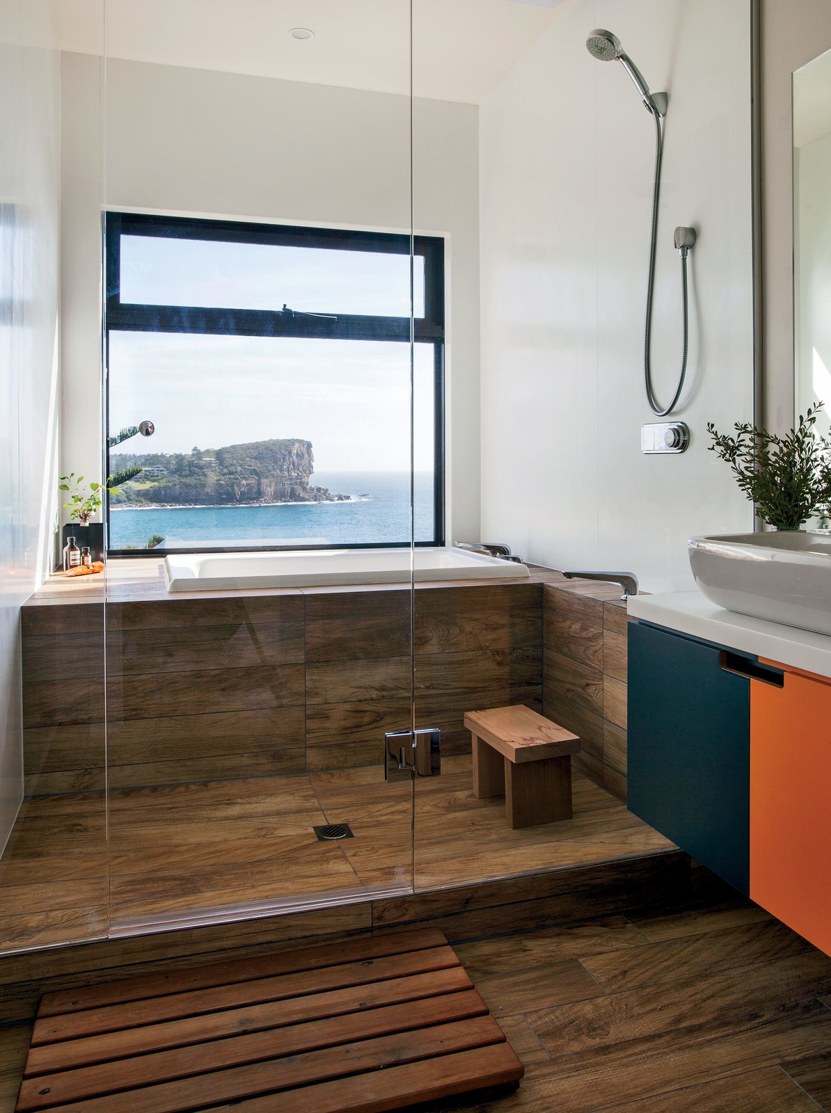 40 Modern Bathtubs That Soak In the View The residents, who previously lived in Japan, asked that the bathroom be modeled after a Japanese-style bathhouse. Wood-effect porcelain tiles from Ariostea line the shower and tub area.