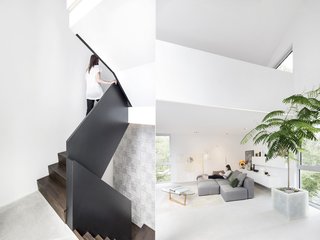 11 Modern Stairways That Do Way More Than Just Connect Floors - Photo 3 of 11 - Designed to read like a piece of furniture, this staircase features handsome wood steps and a metal railing. Balaban flipped the traditional hierarchy of the house and placed bedrooms on the ground floor and living spaces on the second story. 