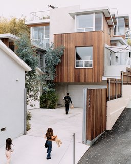 Two Houses Are Better Than One - Photo 1 of 13 - Making use of the hilltop location, each window was planned to frame interesting vistas or to find the best sight lines around adjoining buildings.