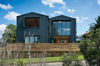 The exterior of the Popadich residence is modeled after boat storage sheds, while the interior is outfitted with industrial concrete and ply.