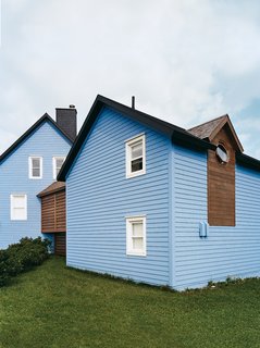 Glimpsed from the outside, it becomes clear how an internal corridor flows through both structures at an uncommon angle.