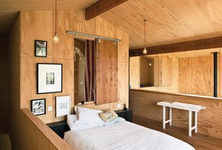 Floor BoredAbbe and Davor worried that plywood floors in the mezzanine bedroom would feel monotonous, given that the walls and ceilings were ply too. So they sourced second-grade French oak floorboards and filled in the holes in the timber’s knots themselves. Then they used leftover boards to make a door to cover a small opening between their room and August’s and for the sliding pantry door in the kitchen.<br><br>qualitywoodfloors.co.nz <br><br>Don't miss a word of Dwell! Download our FREE app from iTunes, friend us on Facebook, or follow us on Twitter!