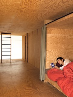 The second floor houses three lits bretons, boxlike compartments where the curtains can be drawn to close sleepers off from the world. Inside, each has a built-in shelf for personal belongings and a favorite read.