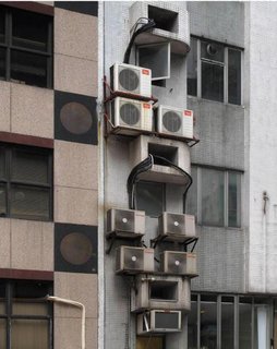 Megacity Living in Hong Kong: Architecture of Density - Photo 3 of 7 - An exterior detail shows a jumble of air-conditioning units. Photo by Michael Wolf, courtesy of the Flowers Gallery.